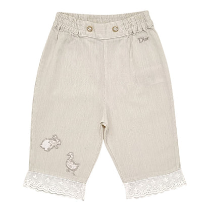 Pantalon bébé fille Baby Dior, beige animaux brodés, taille 6 mois, seconde main luxe, vue de face